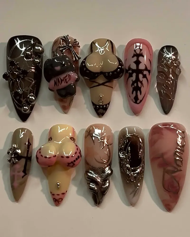 Ten press-on stilettos for the NAMED nails comp: brown and black chrome with 3D crosses, hearts and a figure